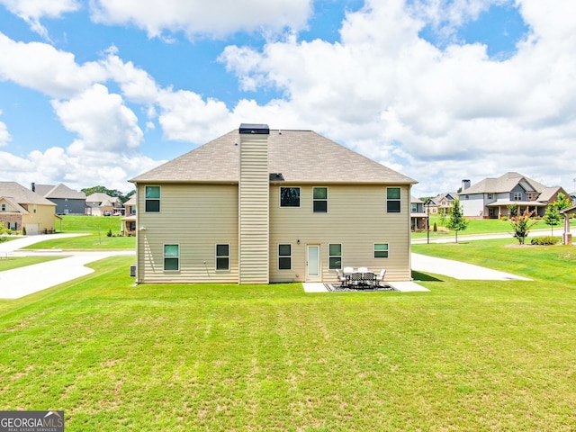117 Elkins Blvd, Locust Grove, GA 30248 - rear view of property featuring a residential view, a patio area, a lawn, and a shingled roof