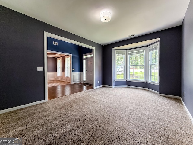 35 Paddle Boat Cv, Senoia, GA 30276 - carpeted spare room featuring wainscoting and baseboards