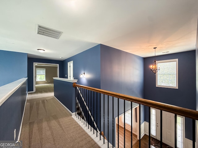 35 Paddle Boat Cv, Senoia, GA 30276 - hall featuring an upstairs landing, a chandelier, and carpet floors