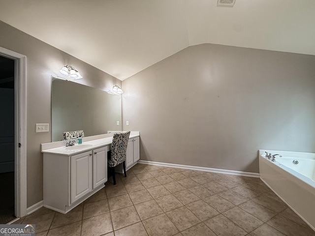 35 Paddle Boat Cv, Senoia, GA 30276 - full bath featuring vaulted ceiling, vanity, a garden tub, and tile patterned flooring