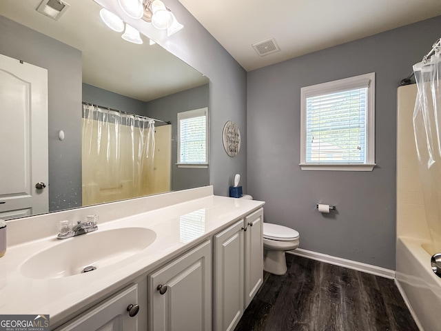 35 Paddle Boat Cv, Senoia, GA 30276 - full bathroom featuring wood finished floors, vanity, and shower / tub combo with curtain