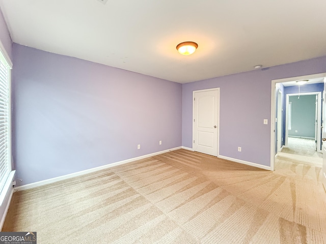 35 Paddle Boat Cv, Senoia, GA 30276 - empty room featuring baseboards and light carpet