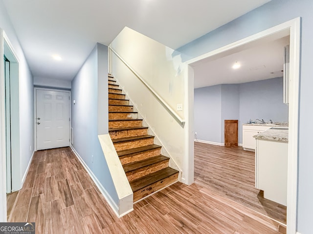 35 Paddle Boat Cv, Senoia, GA 30276 - stairway featuring wood finished floors and baseboards