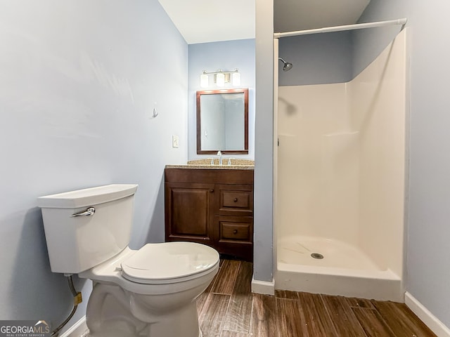 35 Paddle Boat Cv, Senoia, GA 30276 - bathroom featuring wood finished floors, vanity, and a shower