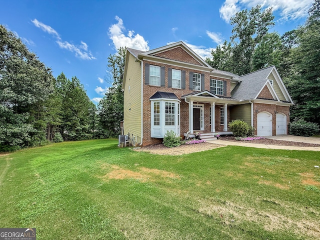 35 Paddle Boat Cv, Senoia, GA 30276 - view of front of home with brick siding, a front lawn, and driveway