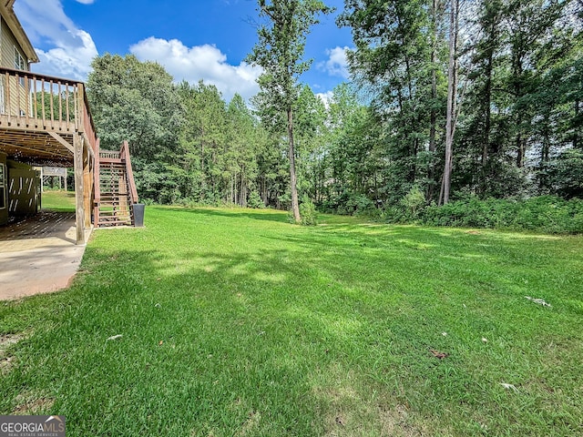 35 Paddle Boat Cv, Senoia, GA 30276 - view of grassy yard featuring stairs and a deck