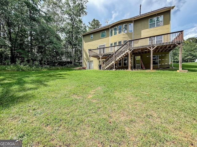 35 Paddle Boat Cv, Senoia, GA 30276 - back of house featuring stairs, a wooden deck, and a yard