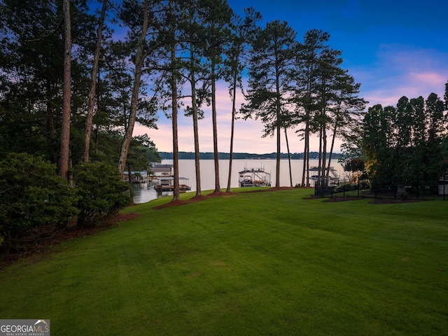 6707 Summer Crest Ct, Flowery Branch, GA 30542 - view of grassy yard with a water view and a boat dock