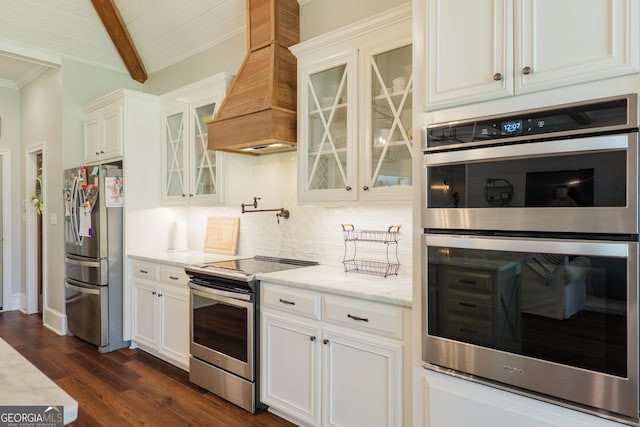 7270 Tillman Branch Rd, Hahira, GA 31632 - kitchen with stainless steel appliances, premium range hood, beam ceiling, decorative backsplash, and light stone counters