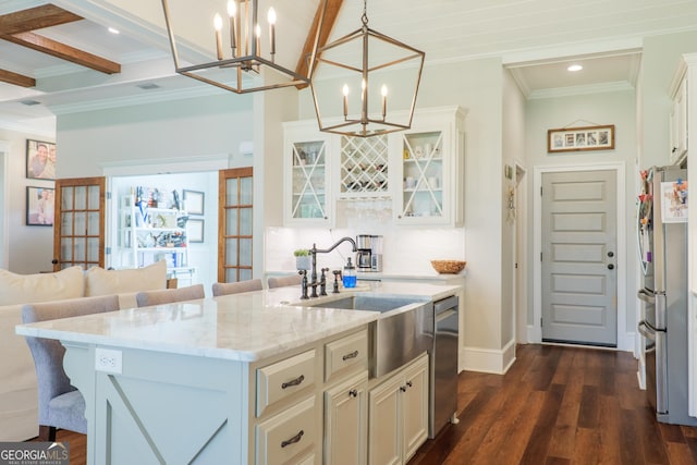 7270 Tillman Branch Rd, Hahira, GA 31632 - kitchen with crown molding, light stone counters, a chandelier, a breakfast bar area, and appliances with stainless steel finishes