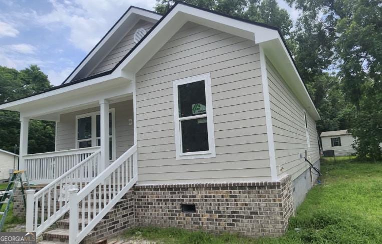 1113 Bates Ave, Savannah, GA 31405 - view of front of home featuring a porch and crawl space