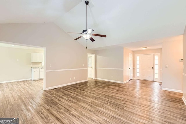 11473 Summer Creek Dr, Hampton, GA 30228 - unfurnished living room with a ceiling fan, light wood-style floors, and high vaulted ceiling