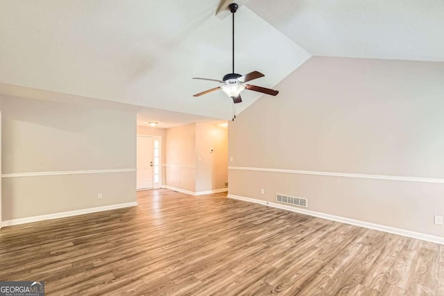 11473 Summer Creek Dr, Hampton, GA 30228 - unfurnished room with vaulted ceiling, wood finished floors, and a ceiling fan
