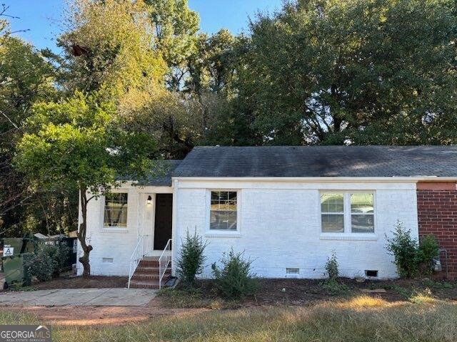 1764 Cahoon St SW, Atlanta, GA 30310 - ranch-style home with crawl space, a shingled roof, and brick siding