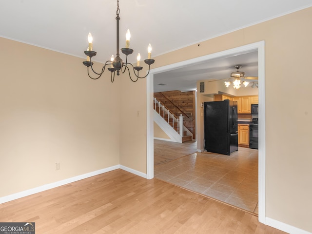 778 Leguin Mill Rd, Locust Grove, GA 30248 - unfurnished dining area with stairs, a chandelier, crown molding, and light wood-style floors