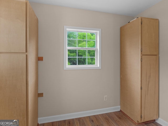 778 Leguin Mill Rd, Locust Grove, GA 30248 - unfurnished bedroom featuring wood finished floors and baseboards