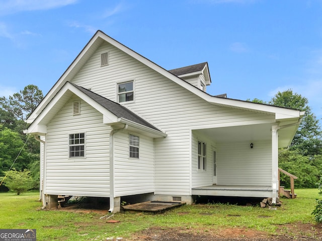 778 Leguin Mill Rd, Locust Grove, GA 30248 - back of house featuring roof with shingles and a lawn