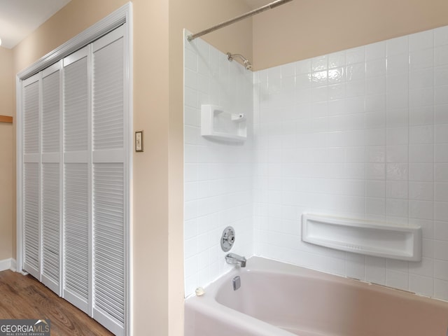 778 Leguin Mill Rd, Locust Grove, GA 30248 - bathroom with tub / shower combination and wood finished floors