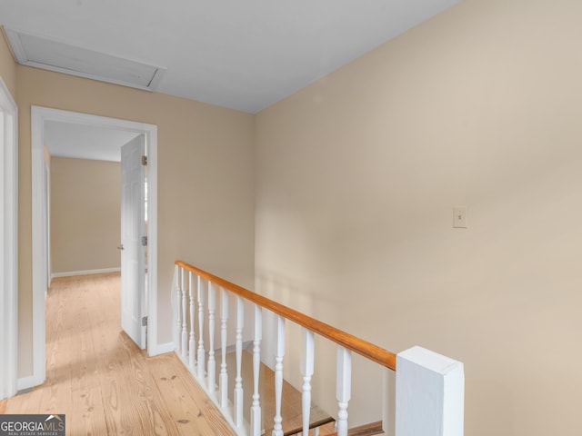 778 Leguin Mill Rd, Locust Grove, GA 30248 - hallway with an upstairs landing and light wood-style flooring