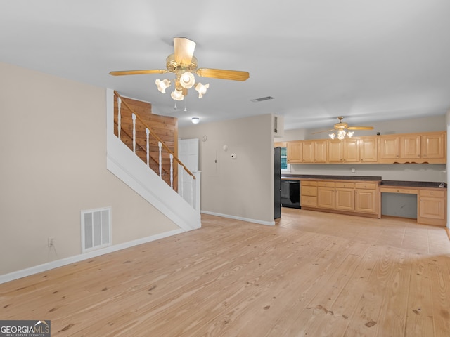 778 Leguin Mill Rd, Locust Grove, GA 30248 - unfurnished living room with a ceiling fan, light wood finished floors, and stairs