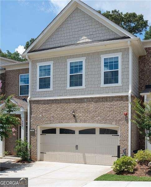 203 Holden Way, Woodstock, GA 30189 - view of front facade featuring an attached garage and concrete driveway