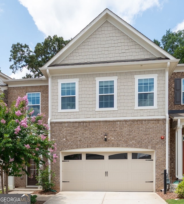 203 Holden Way, Woodstock, GA 30189 - view of front of home featuring a garage, driveway, and brick siding