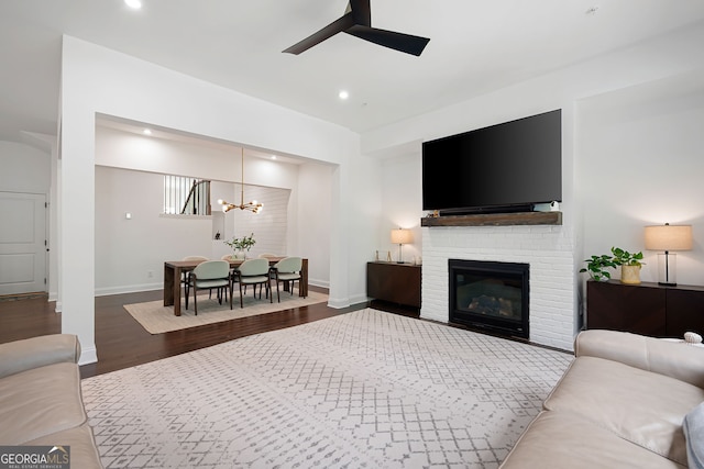 203 Holden Way, Woodstock, GA 30189 - living room featuring a ceiling fan, wood finished floors, recessed lighting, a fireplace, and a chandelier
