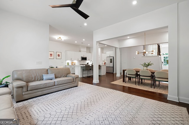 203 Holden Way, Woodstock, GA 30189 - living room featuring a ceiling fan, dark wood-style floors, a chandelier, and recessed lighting