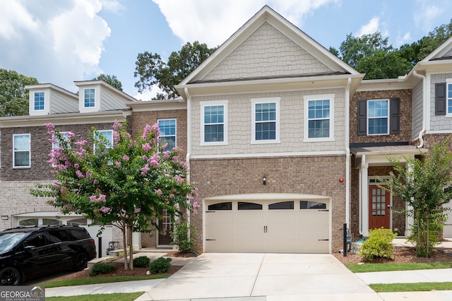 203 Holden Way, Woodstock, GA 30189 - view of front facade with concrete driveway, brick siding, and a garage