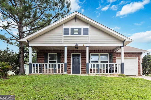 1147 Dunivin Dr, Jonesboro, GA 30238 - view of front of home with a porch, brick siding, a garage, and a front lawn