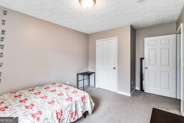 1147 Dunivin Dr, Jonesboro, GA 30238 - bedroom with carpet flooring and a textured ceiling