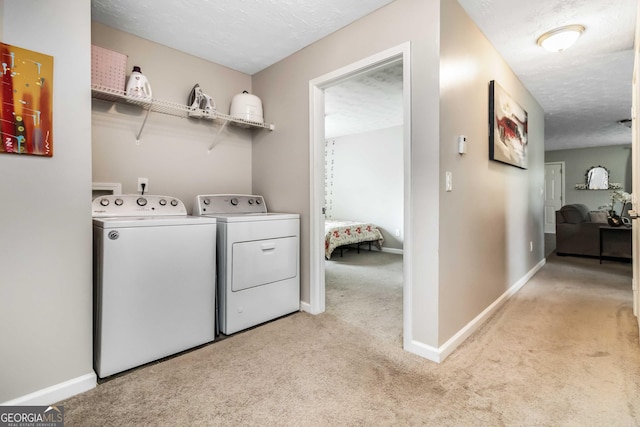 1147 Dunivin Dr, Jonesboro, GA 30238 - washroom with washer and clothes dryer and light carpet