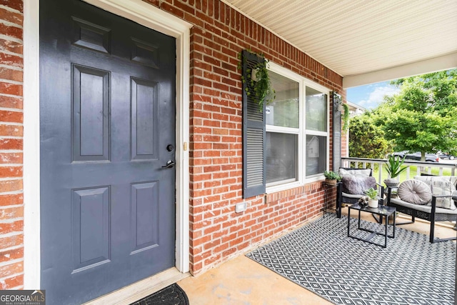 1147 Dunivin Dr, Jonesboro, GA 30238 - property entrance with covered porch and brick siding