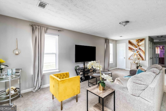1147 Dunivin Dr, Jonesboro, GA 30238 - carpeted living area with a textured ceiling