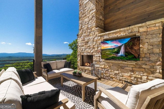 126 Wawayanda Dr, Mineral Bluff, GA 30559 - view of patio / terrace with a mountain view and an outdoor living space with a fireplace
