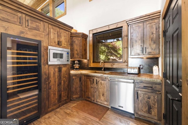 126 Wawayanda Dr, Mineral Bluff, GA 30559 - kitchen with stainless steel appliances, wine cooler, plenty of natural light, and wood finished floors