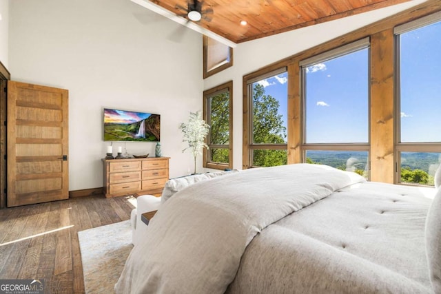 126 Wawayanda Dr, Mineral Bluff, GA 30559 - bedroom featuring hardwood / wood-style flooring, lofted ceiling, wood ceiling, multiple windows, and a ceiling fan