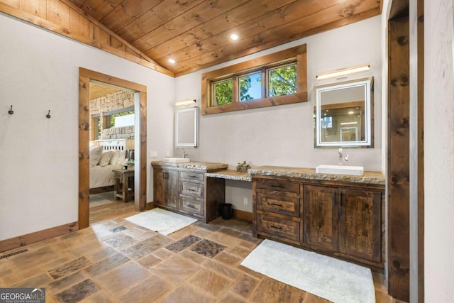 126 Wawayanda Dr, Mineral Bluff, GA 30559 - full bath featuring wooden ceiling, double vanity, lofted ceiling, stone tile flooring, and ensuite bath