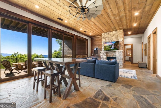 126 Wawayanda Dr, Mineral Bluff, GA 30559 - dining space featuring wood ceiling, stone flooring, a fireplace, and recessed lighting