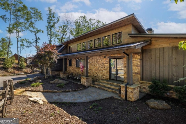 126 Wawayanda Dr, Mineral Bluff, GA 30559 - view of front of home featuring stone siding and a metal roof