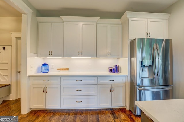3076 E Lake Rd, Mcdonough, GA 30252 - kitchen with stainless steel fridge with ice dispenser, white cabinets, light countertops, and dark wood-type flooring