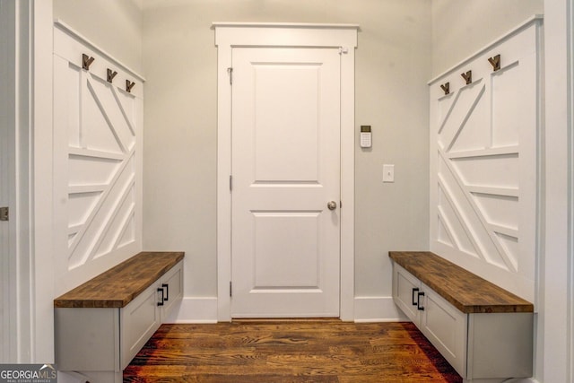 3076 E Lake Rd, Mcdonough, GA 30252 - mudroom featuring dark wood-style flooring and baseboards