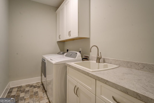 3076 E Lake Rd, Mcdonough, GA 30252 - laundry area featuring cabinet space and independent washer and dryer