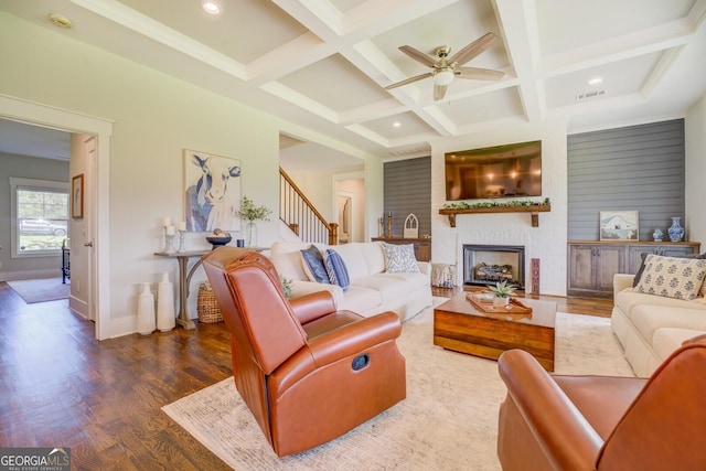 3076 E Lake Rd, Mcdonough, GA 30252 - living room featuring a ceiling fan, wood finished floors, stairs, beam ceiling, and coffered ceiling