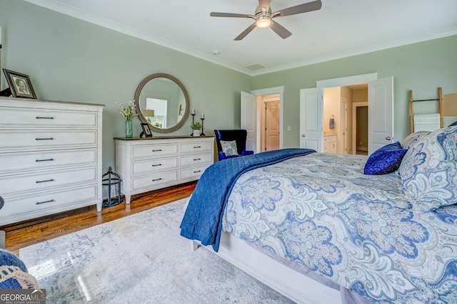 3076 E Lake Rd, Mcdonough, GA 30252 - bedroom with dark wood-style floors, ornamental molding, and ceiling fan