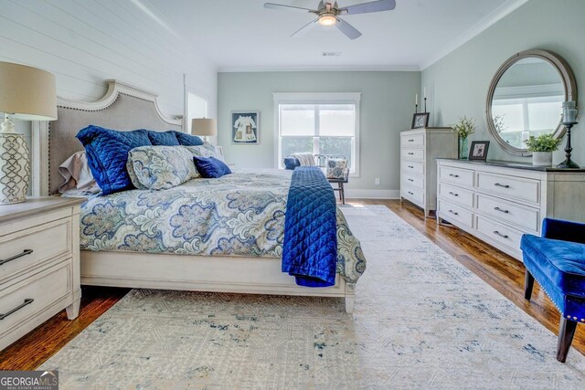 3076 E Lake Rd, Mcdonough, GA 30252 - bedroom featuring multiple windows, ornamental molding, dark wood-style flooring, and ceiling fan