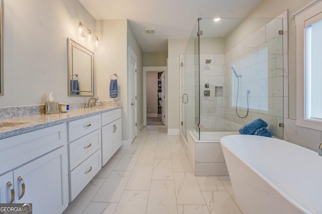3076 E Lake Rd, Mcdonough, GA 30252 - full bath with a shower stall, a freestanding bath, double vanity, and marble finish floors