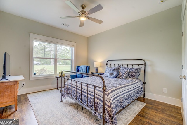 3076 E Lake Rd, Mcdonough, GA 30252 - bedroom with wood finished floors and ceiling fan