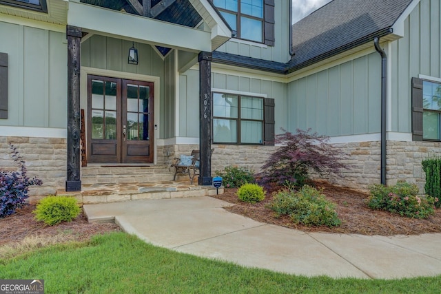 3076 E Lake Rd, Mcdonough, GA 30252 - entrance to property with board and batten siding, stone siding, roof with shingles, and french doors