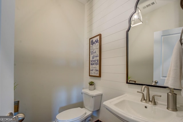 3076 E Lake Rd, Mcdonough, GA 30252 - bathroom featuring wood walls
